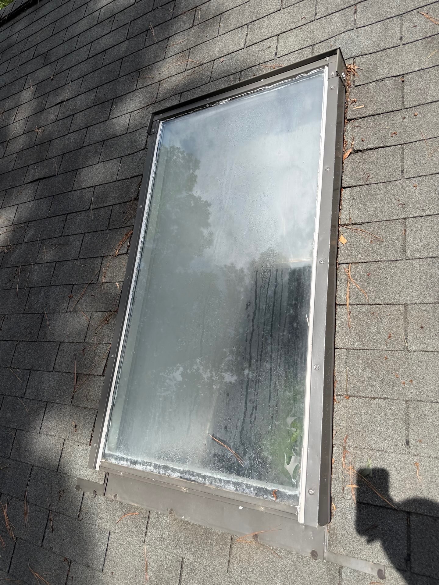 Before — old foggy skylight with failing seal